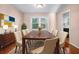 Bright dining room with hardwood floors and large windows at 5823 Button Gwinnett Pl, Norcross, GA 30093