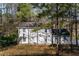 Two story home with a tree lined yard at 5823 Button Gwinnett Pl, Norcross, GA 30093