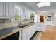 Bright kitchen with essential appliances, a double sink, and outside views at 5823 Button Gwinnett Pl, Norcross, GA 30093