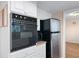 Built-in oven, microwave and stainless steel refrigerator at 5823 Button Gwinnett Pl, Norcross, GA 30093