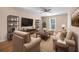 Spacious living room with neutral decor and hardwood floors at 5823 Button Gwinnett Pl, Norcross, GA 30093