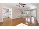 Open concept living room with hardwood floors at 5823 Button Gwinnett Pl, Norcross, GA 30093