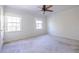 Bright bedroom with neutral carpeting and two windows at 6700 Roswell Rd # 17D, Roswell, GA 30328