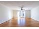 Spacious living room with hardwood floors and French doors leading to patio at 6700 Roswell Rd # 17D, Roswell, GA 30328