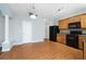 Kitchen with wood cabinets, black appliances, and a breakfast area at 216 Parc View Ln, Woodstock, GA 30188