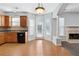 Kitchen with wood cabinets, black appliances, and wood flooring at 216 Parc View Ln, Woodstock, GA 30188