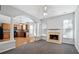Open living room with a fireplace and view into the kitchen at 216 Parc View Ln, Woodstock, GA 30188