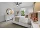 Bright bedroom with a white bed frame and plenty of natural light at 428 Dahlia St, Mcdonough, GA 30253