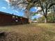 Spacious backyard featuring a brick home and mature trees at 1261 Cliffwood Se Dr, Smyrna, GA 30080