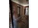 Unfinished basement with exposed brick walls and debris at 1261 Cliffwood Se Dr, Smyrna, GA 30080