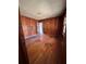 Bedroom with wood paneled walls and hardwood floors at 1261 Cliffwood Se Dr, Smyrna, GA 30080