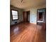 Hardwood floors and light teal walls in this bedroom at 1261 Cliffwood Se Dr, Smyrna, GA 30080