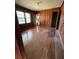 Bedroom with wood paneled walls and hardwood floors at 1261 Cliffwood Se Dr, Smyrna, GA 30080