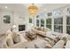 Bright living room featuring a fireplace, neutral furniture and a stunning view of the outdoors at 165 Grayton Ln, Roswell, GA 30075