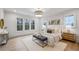 Serene main bedroom featuring a luxurious bed, side tables and stunning views of the outdoors at 165 Grayton Ln, Roswell, GA 30075