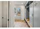 Charming mudroom with blue lockers, bench seating and direct access to the home's front entrance at 165 Grayton Ln, Roswell, GA 30075