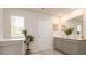 Double vanity bathroom with modern gray cabinets and a large mirror at 2456 Bayberry St, Acworth, GA 30101