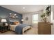 Cozy bedroom with a blue accent wall and plenty of natural light at 2456 Bayberry St, Acworth, GA 30101