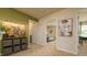 Upstairs hallway with view into bedroom and office, features a contemporary storage unit and artwork, blending style and functionality at 2456 Bayberry St, Acworth, GA 30101