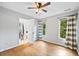 Well-lit bedroom featuring hardwood floors and ample closet space at 4805 Blossom Ct, Cumming, GA 30028