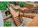 Deck stairs leading down to a backyard pond at 4805 Blossom Ct, Cumming, GA 30028