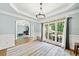 Formal dining room with hardwood floors, large windows and a chandelier at 4805 Blossom Ct, Cumming, GA 30028