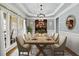 Formal dining room with hardwood floors, large windows and a chandelier at 4805 Blossom Ct, Cumming, GA 30028