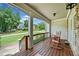 Inviting front porch with rocking chairs and treetop views at 4805 Blossom Ct, Cumming, GA 30028