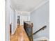 Upstairs hallway with wood floors and a wooden railing at 4805 Blossom Ct, Cumming, GA 30028