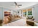 Open living room with kitchen views and hardwood floors at 4805 Blossom Ct, Cumming, GA 30028