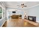 Open concept living room with hardwood floors and natural light at 4805 Blossom Ct, Cumming, GA 30028