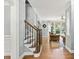 Elegant staircase with wrought iron railing and hardwood floors at 4805 Blossom Ct, Cumming, GA 30028