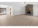 Spacious living room with stone fireplace and laminate flooring at 1237 Torrey Pl, Dacula, GA 30019