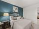 Bedroom with queen bed and teal accent wall at 2476 Bayberry St, Acworth, GA 30101