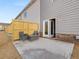 Private outdoor patio featuring a seating area and gray exterior walls, creating a cozy retreat at 2476 Bayberry St, Acworth, GA 30101