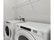 Laundry room with Whirlpool washer and dryer at 329 Foxglove Way, Mcdonough, GA 30253