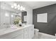 Double vanity bathroom with white cabinets and quartz countertop at 336 Foxglove Way, Mcdonough, GA 30253