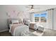 Twin bedroom with soft pink and white decor at 336 Foxglove Way, Mcdonough, GA 30253