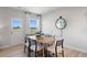 Bright dining room with wood table and chairs, and access to backyard at 336 Foxglove Way, Mcdonough, GA 30253