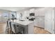 Modern kitchen with white cabinets, quartz countertops, and island at 336 Foxglove Way, Mcdonough, GA 30253