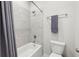 Simple bathroom with a shower/tub combo and neutral decor at 4169 Wood Fern Ln, Buford, GA 30519