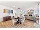 Open concept dining area with seating for four, adjacent to living room at 4169 Wood Fern Ln, Buford, GA 30519