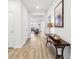 Bright and spacious entryway with hardwood floors and console table at 4169 Wood Fern Ln, Buford, GA 30519