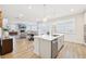 Open concept kitchen with large island and stainless steel appliances at 4169 Wood Fern Ln, Buford, GA 30519