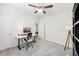 Bright office space with desk, chair, and floor lamp at 4169 Wood Fern Ln, Buford, GA 30519