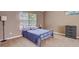 Charming bedroom featuring a double bed and window at 9265 Tara Sw Dr, Covington, GA 30014