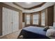 Bedroom with bay window and double doors at 9265 Tara Sw Dr, Covington, GA 30014