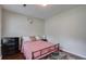 Bright bedroom with a double bed and dark dresser at 9265 Tara Sw Dr, Covington, GA 30014