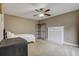 Cozy bedroom with fireplace and carpet flooring at 9265 Tara Sw Dr, Covington, GA 30014