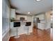 Eat-in kitchen with stainless steel appliances and hardwood floors at 9265 Tara Sw Dr, Covington, GA 30014